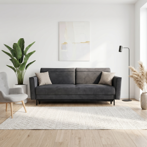 Kanapa z funkcją spania na wysokich 15cm czarnych nóżkach, posiada boczki. Tkanina gładka, odcień grafit. Showroom