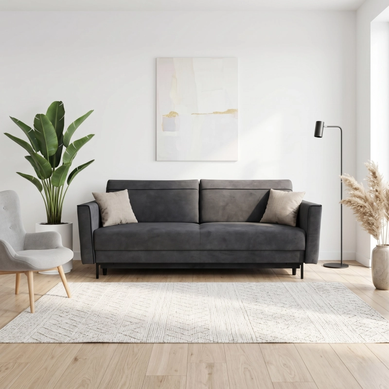 Kanapa z funkcją spania na wysokich 15cm czarnych nóżkach, posiada boczki. Tkanina gładka, odcień grafit. Showroom