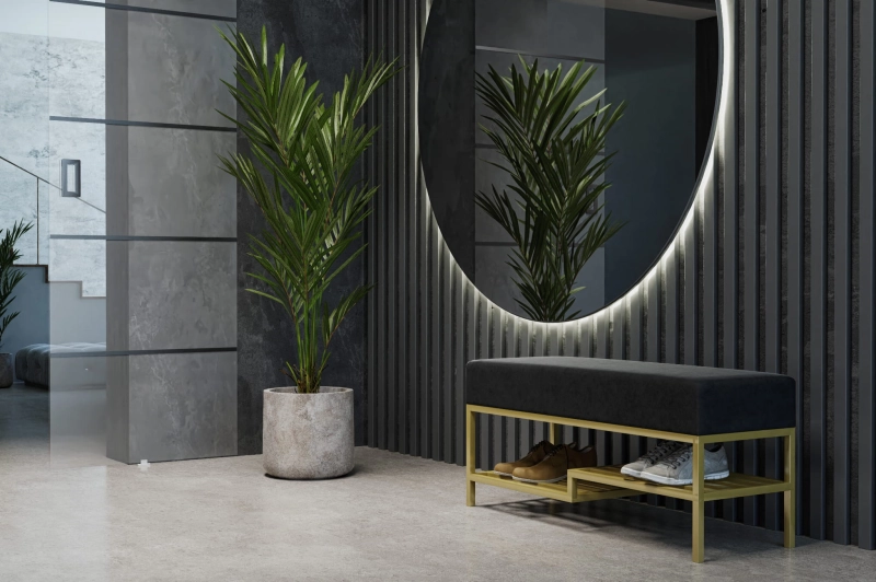 Ławka tapicerowana do przedpokoju z dwustopniowym miejscem na buty, stelaż złoty, tkanina gładka welur odcień czarny. Showroom