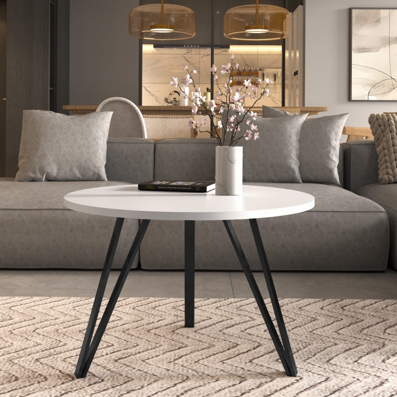 Stolik kawowy na potrójnych czarnych nogach, blat okrągły biały. Showroom